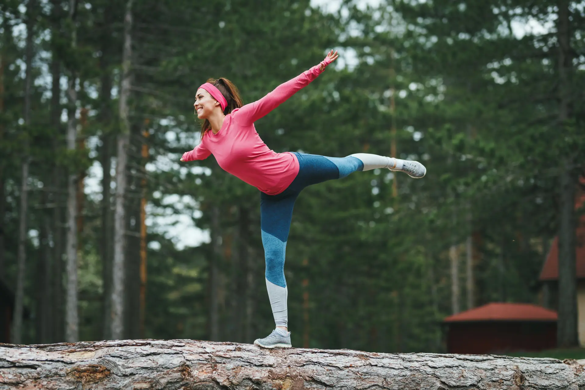 An athletic woman holding a yoga pose